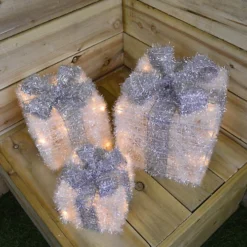 3 Piece Warm White LEDs Battery Operated Silver Christmas Gift Boxes With Timer 6 3 Piece Warm White LEDs Battery Operated Silver Christmas Gift Boxes With Timer -Deals Christmas Decor Store 3 piece warm white leds battery operated silver christmas gift boxes with timer5056589198572 03c MP