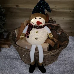 70cm Sitting Light Up Christmas Snowman With Dangly Legs In Warm White LEDs