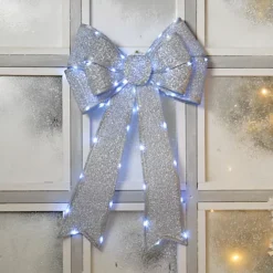 Festive Silver Battery Operated Christmas Door Bow With 84 Warm White LEDs -Deals Christmas Decor Store festive silver battery operated christmas door bow with 84 warm white leds5020244246786 03c MP