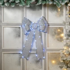 Festive Silver Battery Operated Christmas Door Bow With 84 Warm White LEDs -Deals Christmas Decor Store festive silver battery operated christmas door bow with 84 warm white leds5020244246786 04c MP